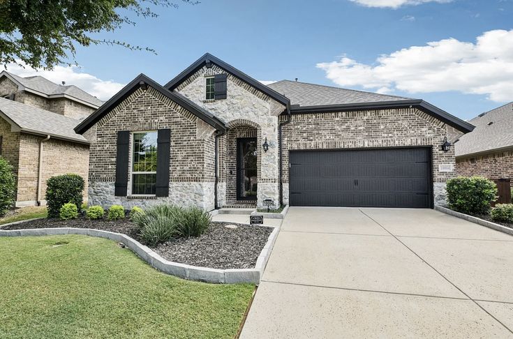 18755 E Crestridge Dr, Centennial, CO — Brick home with dark trim and a low-maintenance front bed